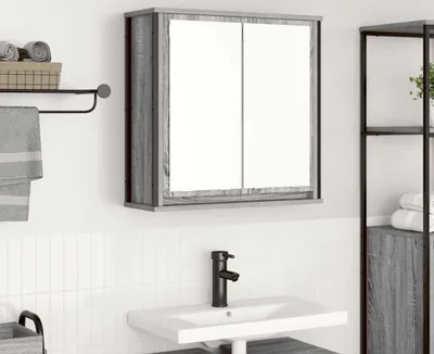 A bathroom vanity with a medicine cabinet and sink.