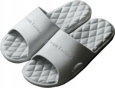 A pair of light gray shower slides are shown against a white background.