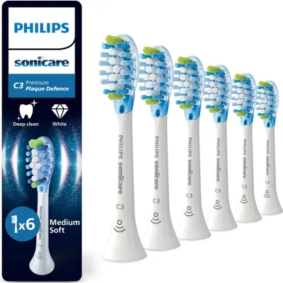 A set of Philips Sonicare toothbrush heads and packaging.