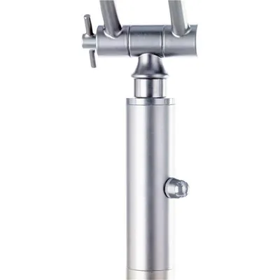 A close-up studio shot of a silver faucet.