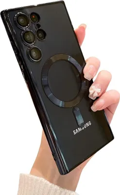 A hand holding a black smartphone case with a magnetic ring on the back.