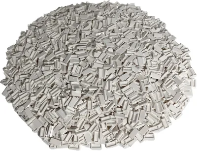 A pile of small white LEGO tiles.