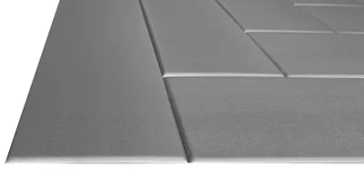 A close-up, angled view of gray decorative foam panels, showing their texture and the grooves between them.