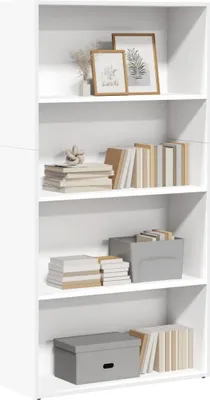 A white bookcase with various items on its shelves.