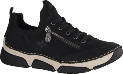 A black sneaker with a beige sole and white stitching, shown from the side.