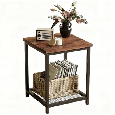 A square side table with a wood-look top and black metal frame, decorated with a vase of flowers, a small radio, and a candle on top, and a basket of records on the lower shelf.