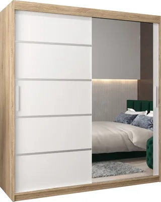 A bedroom scene reflected in a mirrored wardrobe.