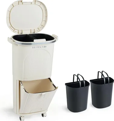 A beige multi-compartment trash can with a lid and a pull-out drawer, shown next to two black bins with handles.