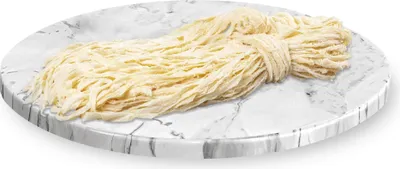 A bundle of raw sausage casings on a marble-patterned plate.