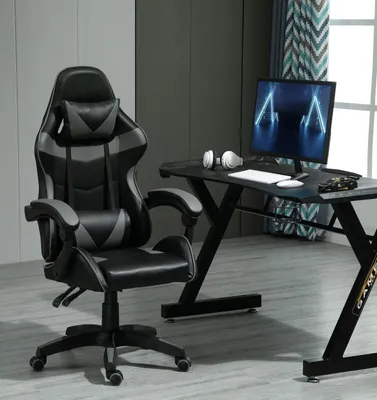 A gaming chair and desk setup in a room.