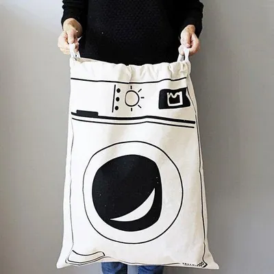 Zdjęcie produktu dla Torba do przechowywania bielizny z sznurkami, torba do przechowywania z płótna - pralka, torba na bieliznę w kolorze białym i czarnym, 65 x 47 cm.