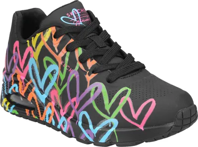 A black sneaker with colorful heart graphics.