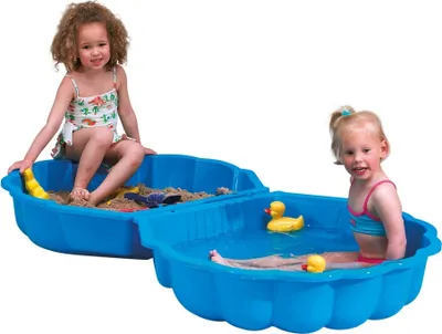 Two young girls are playing in a blue sand and water play station.