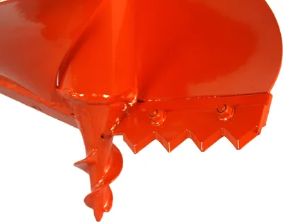 A close-up view of the cutting edge and auger of an orange earth drill.