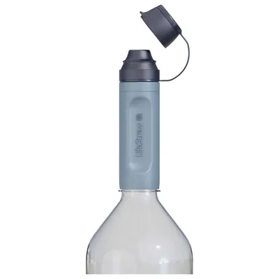 A close-up shot of the top part of a water filter straw attached to a bottle.