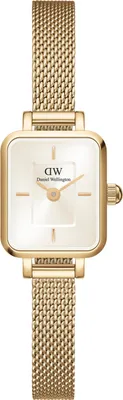 A close-up studio shot of a gold-colored Daniel Wellington watch.
