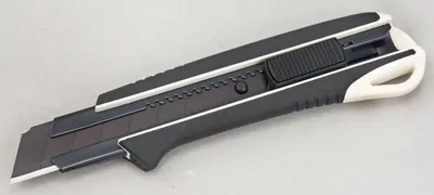 Produktbild von Tajima Cutter 25 mm, Extra Harte Klingenführung und Razar Black Klinge, 1 Stück