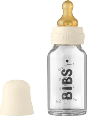 A baby bottle with a nipple and a cap, shown against a white background.