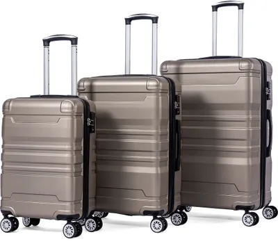 Three suitcases of varying sizes arranged side-by-side against a white background.