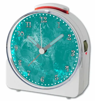 A white alarm clock with a teal face and a red accent on top.