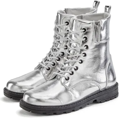 A pair of silver combat boots on a white background.