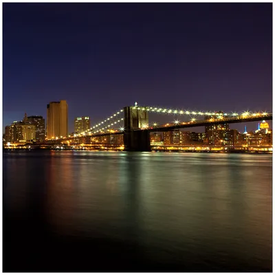 Produktbild von Wallario Sticker / Aufkleber für Kühlschrank / Geschirrspüler / Küchenschränke, selbstklebende Folie - 60 x 60 cm, Motiv: New York Skyline - Brooklyn Bridge und Manhattan am Abend