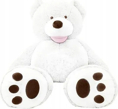 A large, white teddy bear sits with its legs spread out in front of it.