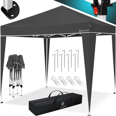 A dark gray pop-up canopy tent is set up, with its accessories laid out around it.