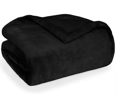 A folded black blanket on a white background.