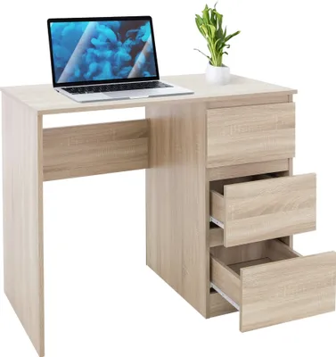 A light wood desk with a laptop, a plant, and three drawers. One drawer is partially open.