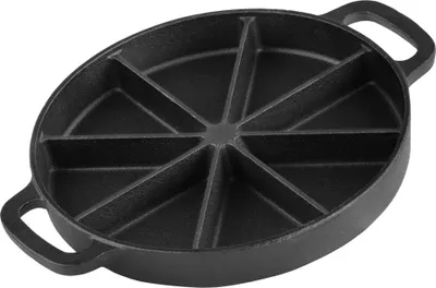 A black cast iron cornbread pan with 8 wedge-shaped sections.