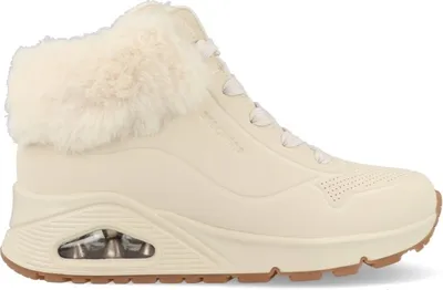 A side view of a beige Skechers winter boot with faux fur trim.