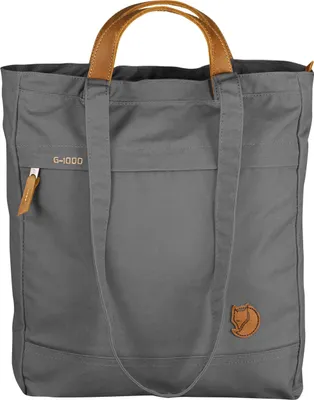 A grey tote bag with brown leather handles and accents, shown against a white background.