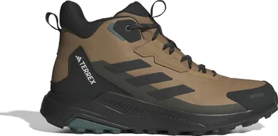 A studio shot of a single brown and black Adidas Terrex hiking boot.