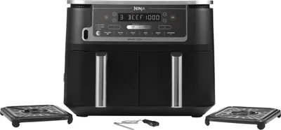 A black Ninja Foodi Max Dual Zone Airfryer is shown from the front, with two square accessories placed on either side.