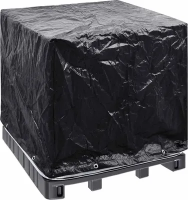 A black tarp covers a square object resting on a black pallet.