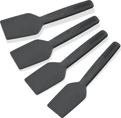 Four black spatulas are arranged diagonally on a white background.