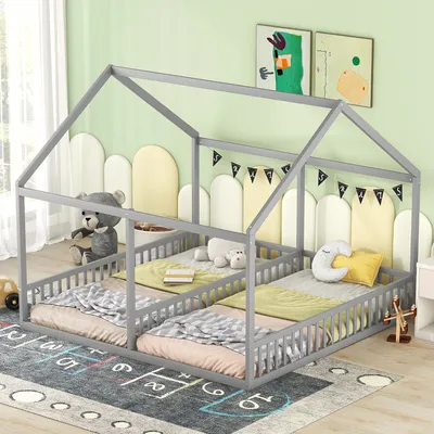 A children's house-shaped bed with two twin mattresses, decorated with stuffed animals and a garland.