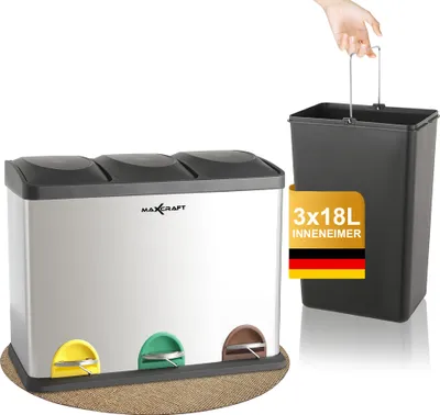 A multi-compartment trash can with three pedal-operated bins, shown next to a separate inner bin with a handle.