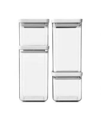 Four clear plastic food storage containers with light gray lids are stacked in two columns against a white background.