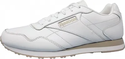 A side view of a white Reebok sneaker.