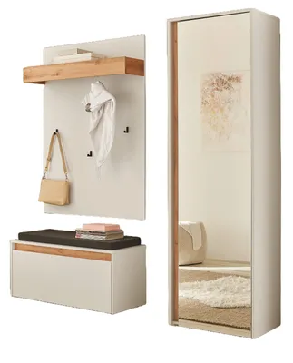 A white and wood-tone entryway furniture set, including a bench with storage, a wall-mounted shelf with hooks, and a full-length mirror cabinet.