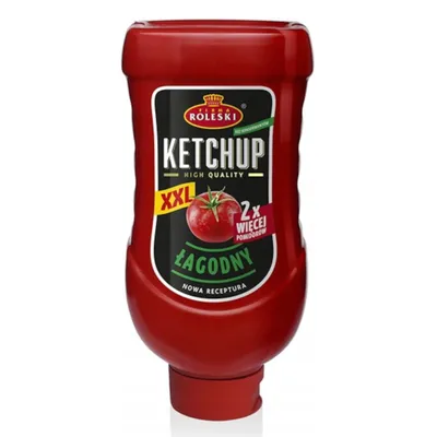 A red ketchup bottle with a label.