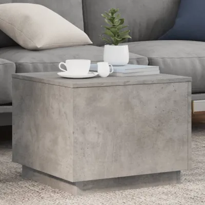 A close-up of a concrete coffee table in a living room setting.