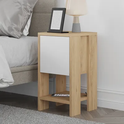 A bedside table next to a bed.