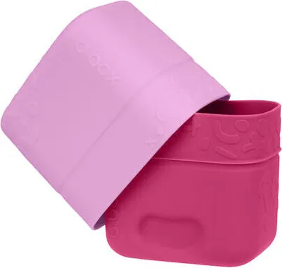 A pink lid is partially covering a rose-colored container.