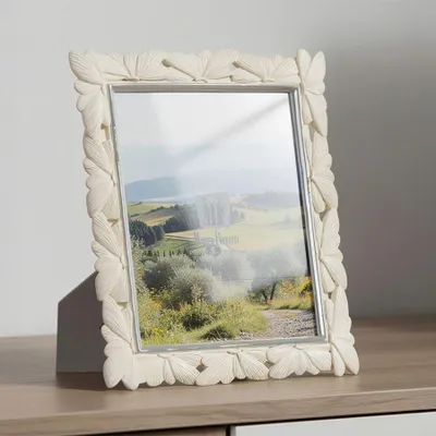 Immagine prodotto di Cornice per foto con rilievo a forma di farfalla, in resina, dimensioni 20x25 cm, color crema, marca Mauro Ferretti