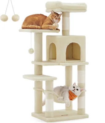 A beige cat tree with two cats on it, one playing and one resting in a hammock.
