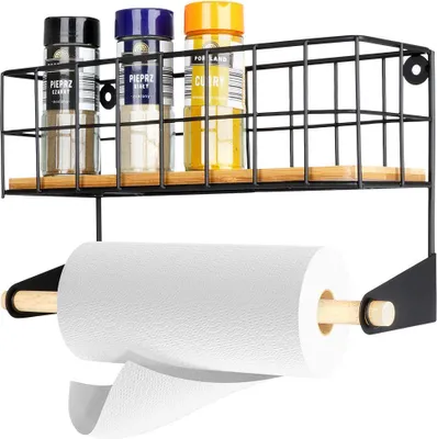 A black metal wall-mounted shelf with a paper towel holder.