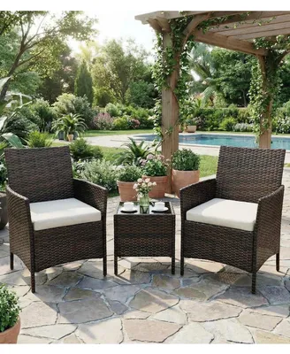 Immagine prodotto di Set da esterno da bistrot composto da 3 pezzi: set di mobili da giardino in rattan sintetico, 2 sedie con cuscini e un tavolo in vetro, ideale per balconi e terrazzi. Colore: marrone beige